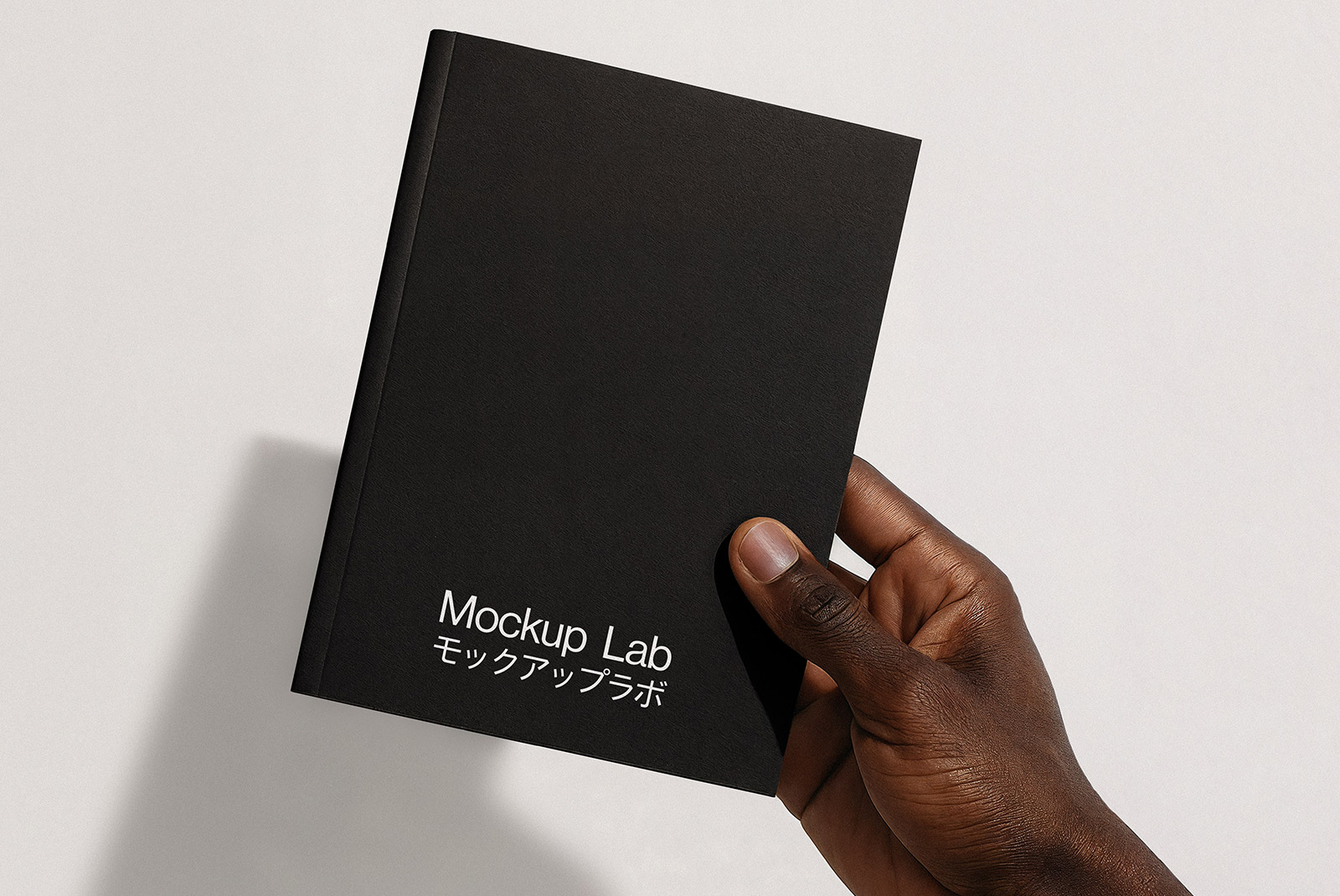 A single notebook mockup presented at a slight angle, showcasing the front cover and spine.